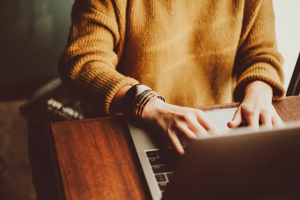 Woman typing on laptop
